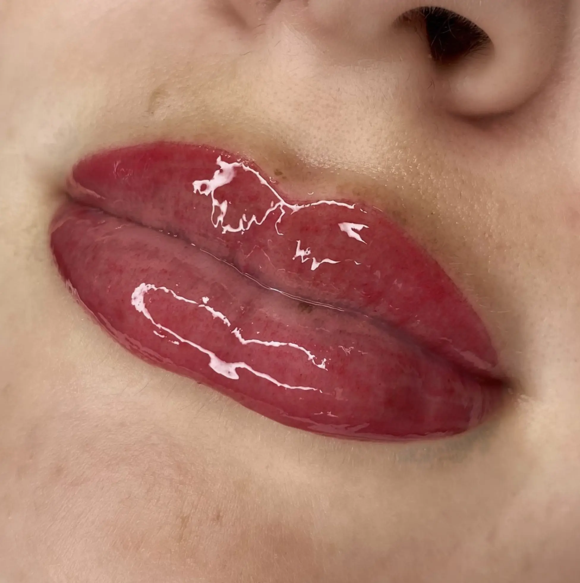 Uneven lip fix with tattoo